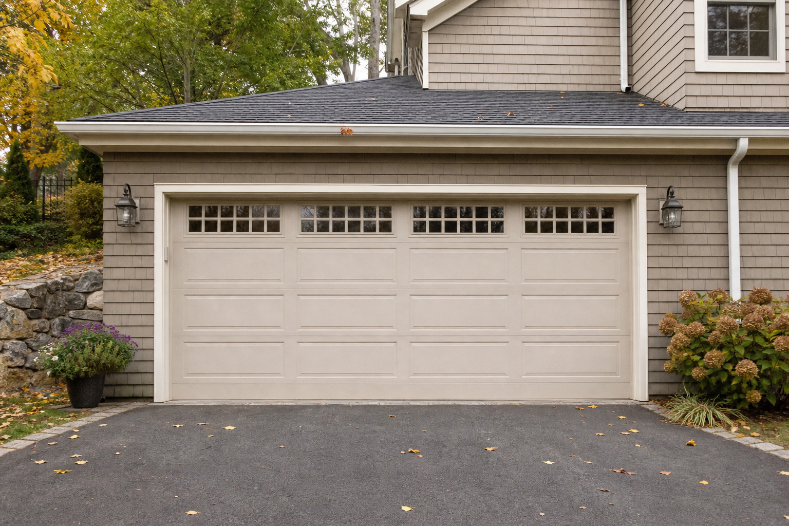 Brookline garage exterior with a full garage door in a clean seasonal neighborhood setting